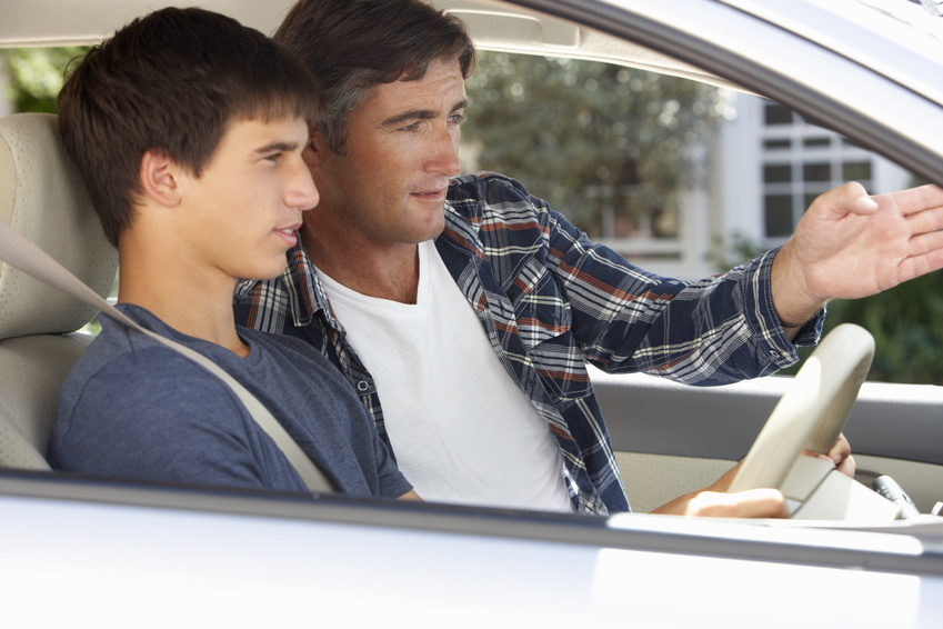 father-teaching-teenage-son-to-drive